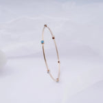 Load image into Gallery viewer, 18K Gold Bangle with Blue Stones Caia