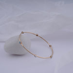 Load image into Gallery viewer, 18K Gold Bangle with Blue Stones