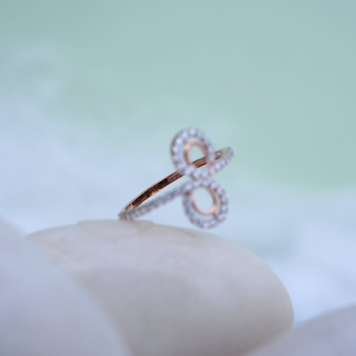 9k rose gold infinity ring with cz stones