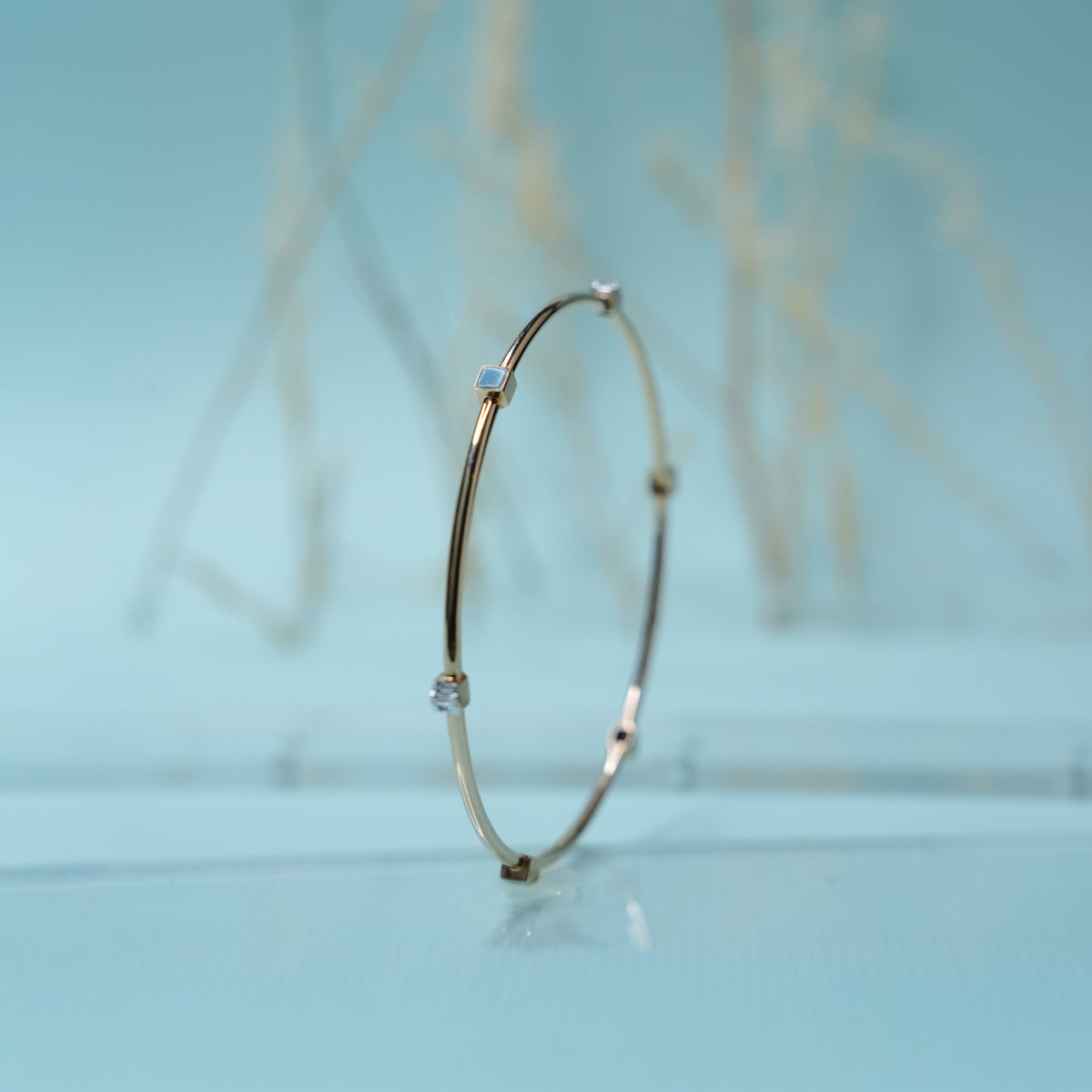 18k gold bangle with blue stones